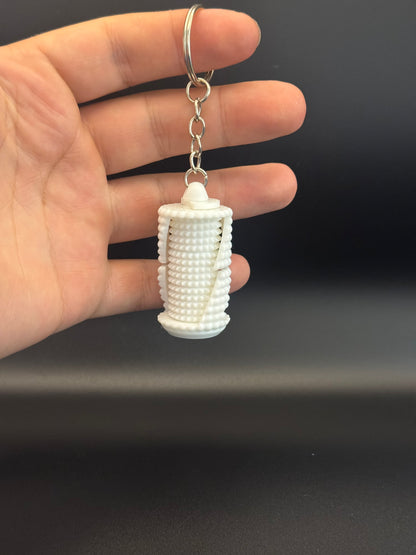 Grenade fidget spinner keyring held in hand