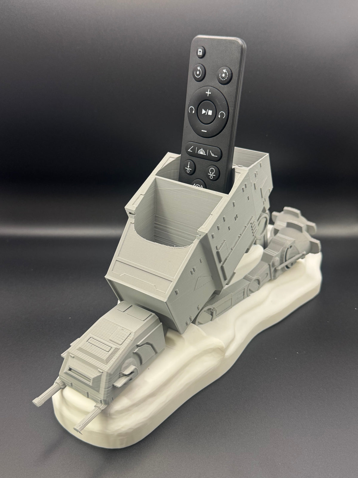 Sci-fi spaceship remote holder with TV remote